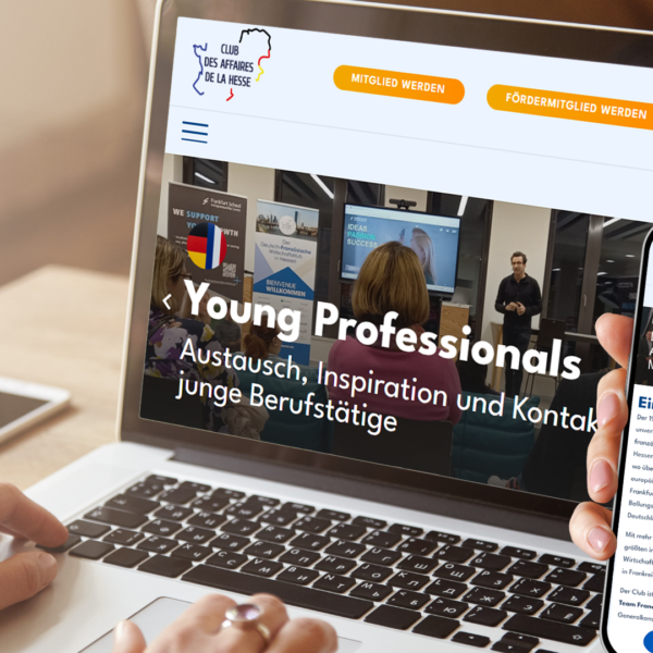 Ein Laptop und ein Smartphone zeigen das responsive Webdesign der neuen Website des Club des Affaires de la Hesse nach dem Plattform-Relaunch.